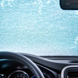 Ice and snow covered car windshield