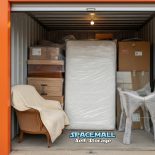 A nicely packed storage unit framed in orange.